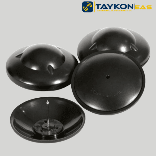 Nedap R40 siyah alarm etiketi – masa üzerinde sergilenen perakende güvenlik çözümü